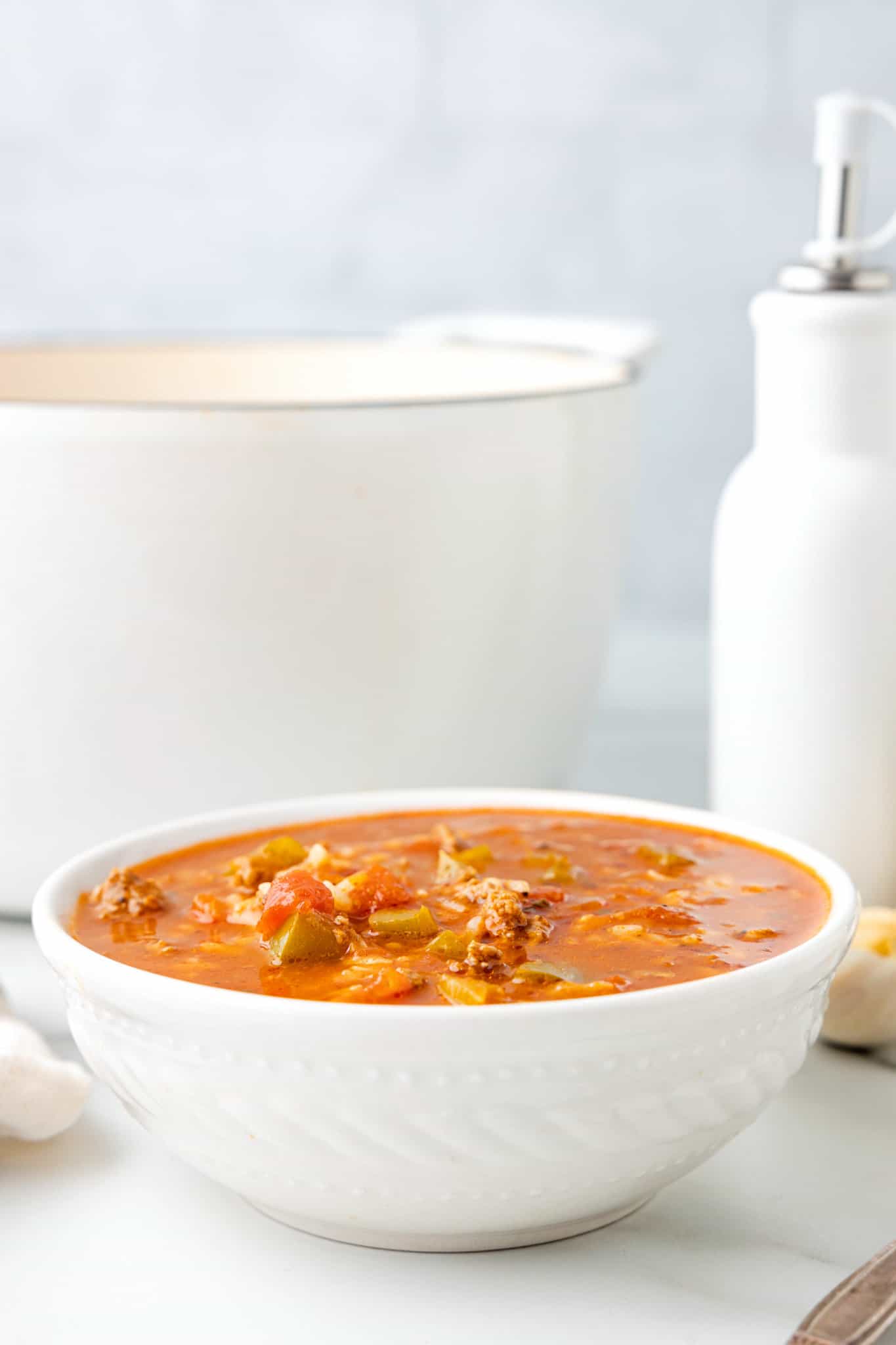 Stuffed Pepper Soup is a hearty soup recipe loaded with ground beef, diced green bell peppers, diced tomatoes and rice.