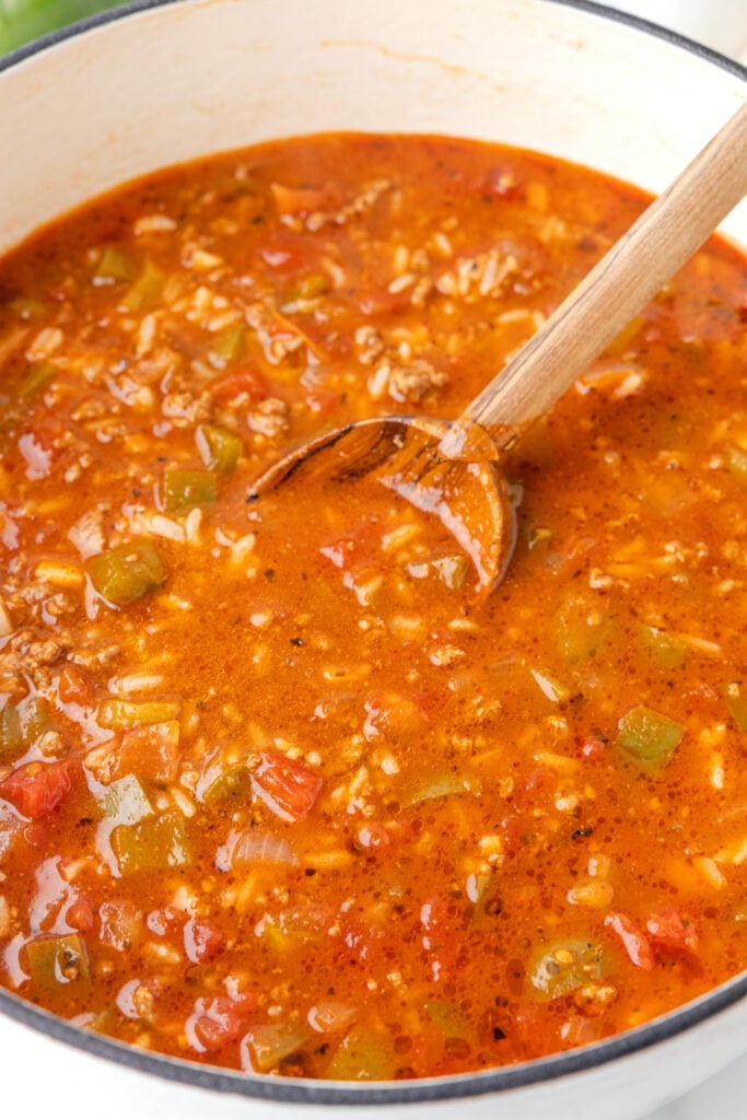 Stuffed Pepper Soup is a hearty soup recipe loaded with ground beef, diced green bell peppers, diced tomatoes and rice.