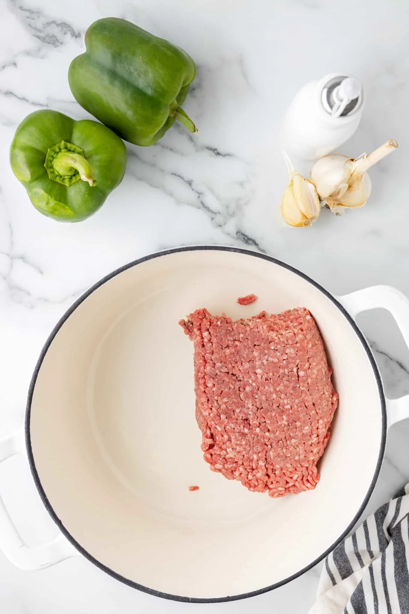 ground beef in a pot before cooking