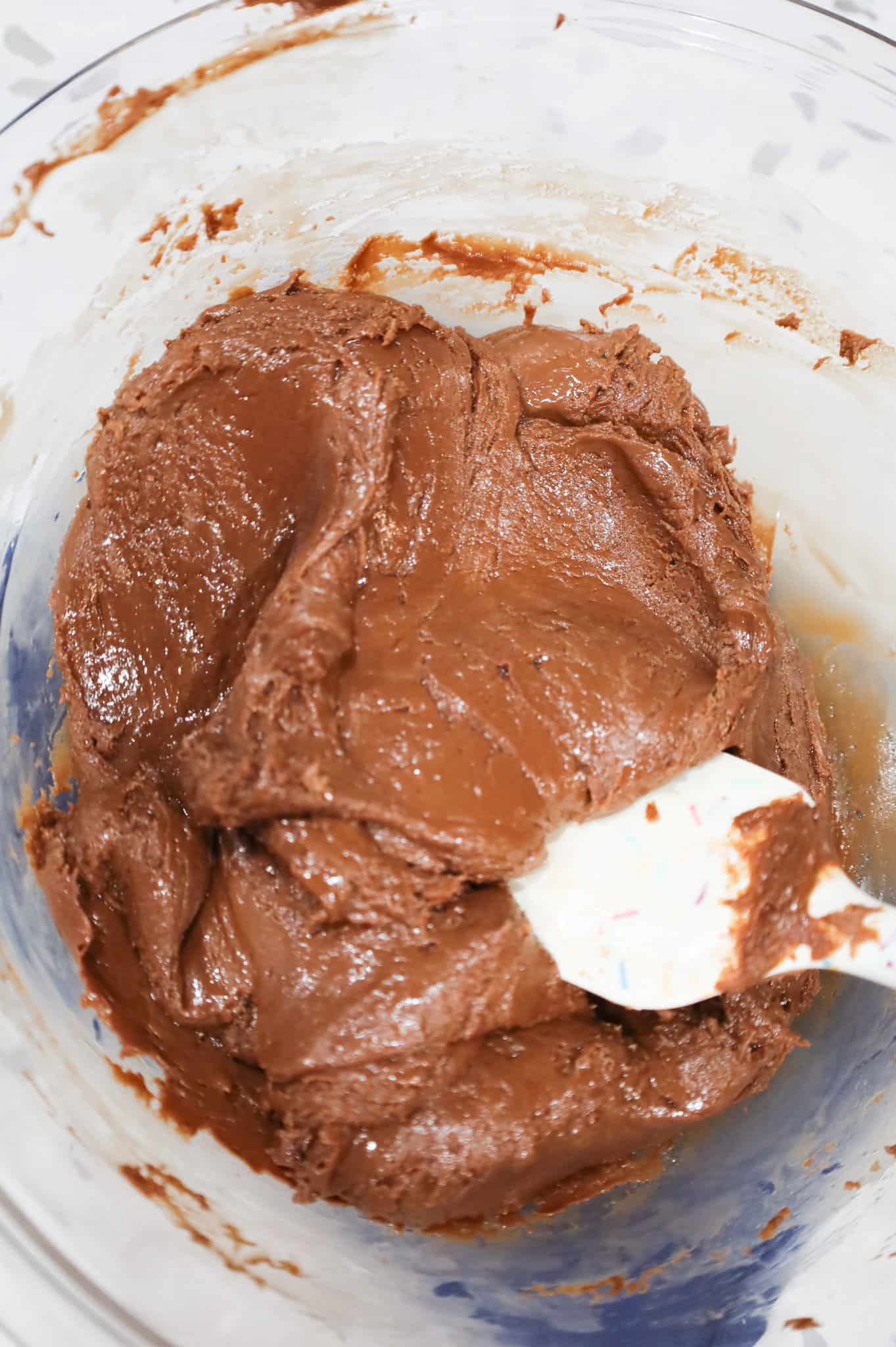 milk chocolate chips and condensed milk mixture in a bowl