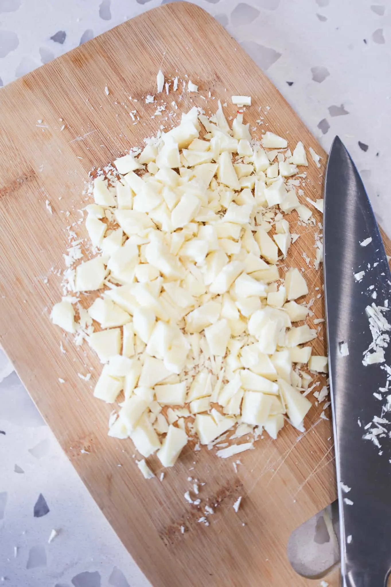 chopped white chocolate on a cutting board