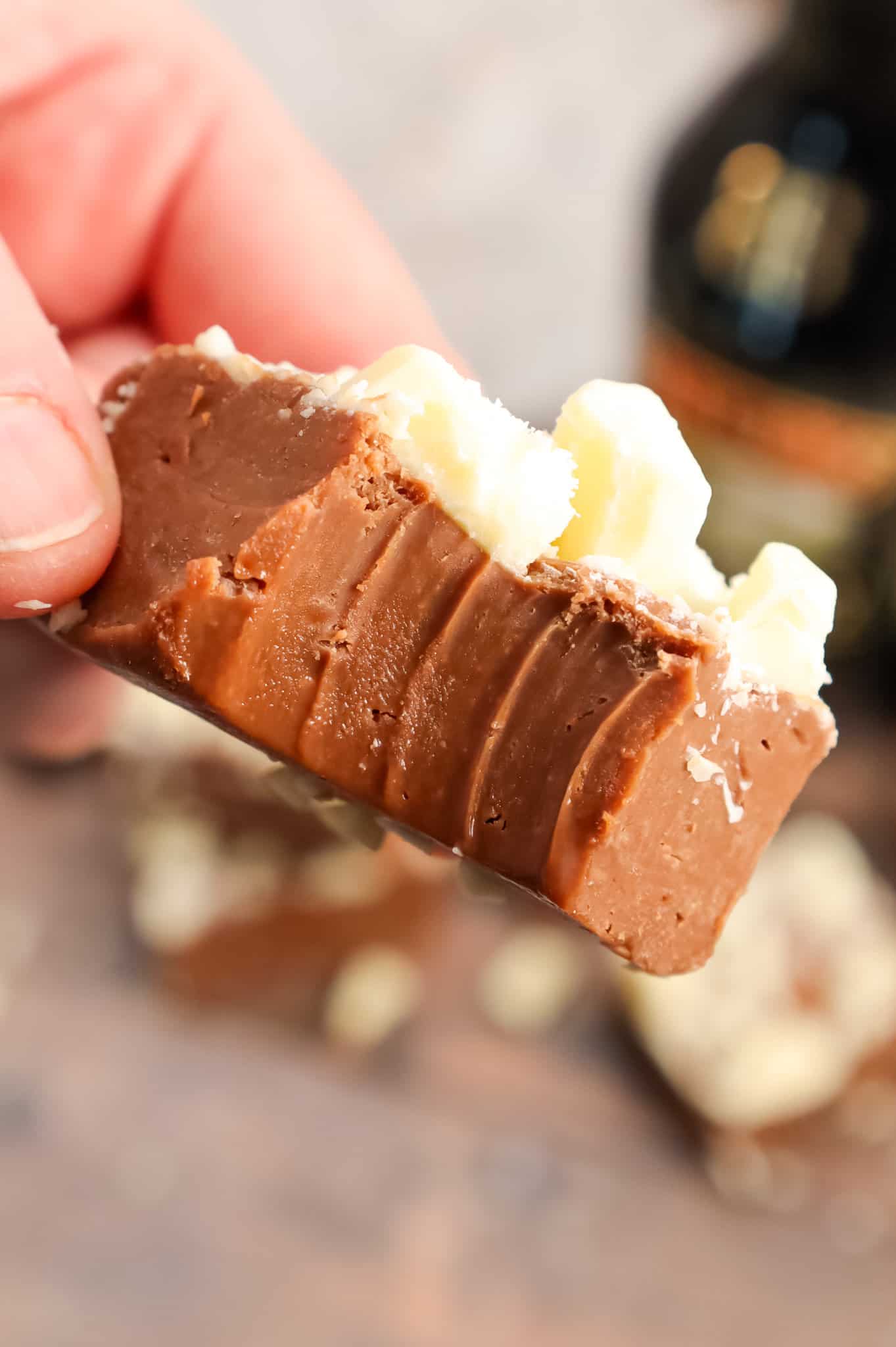 Bailey's Fudge is an easy chocolate fudge recipe made with milk chocolate chips, sweetened condensed milk and Bailey's Irish cream and topped with chopped white chocolate.