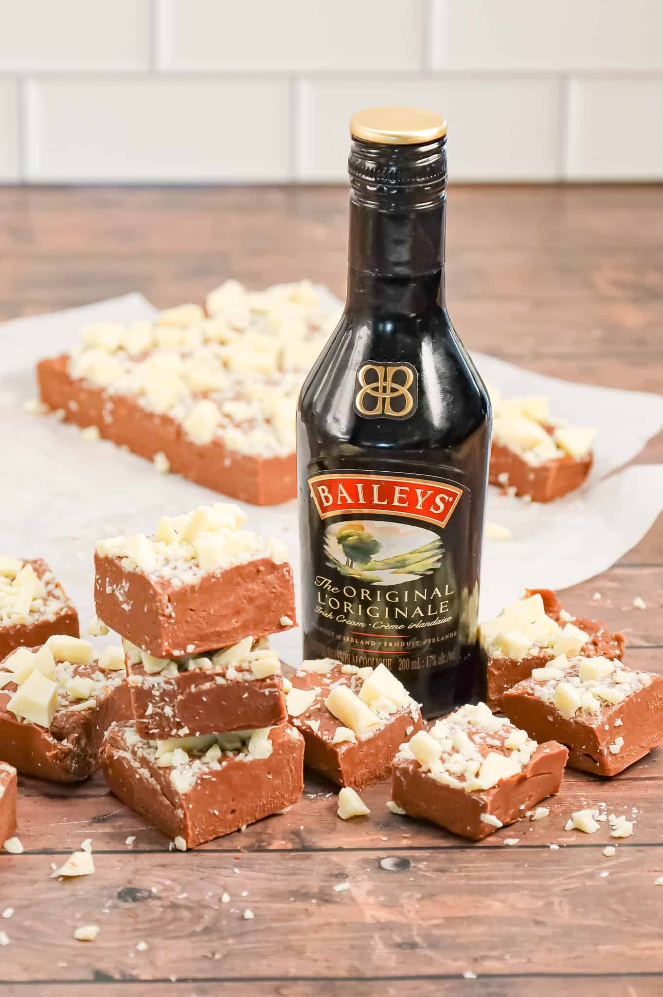 Bailey's Fudge is an easy chocolate fudge recipe made with milk chocolate chips, sweetened condensed milk and Bailey's Irish cream and topped with chopped white chocolate.