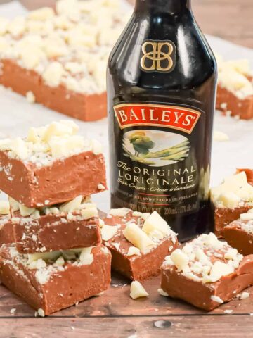 Bailey's Fudge is an easy chocolate fudge recipe made with milk chocolate chips, sweetened condensed milk and Bailey's Irish cream and topped with chopped white chocolate.