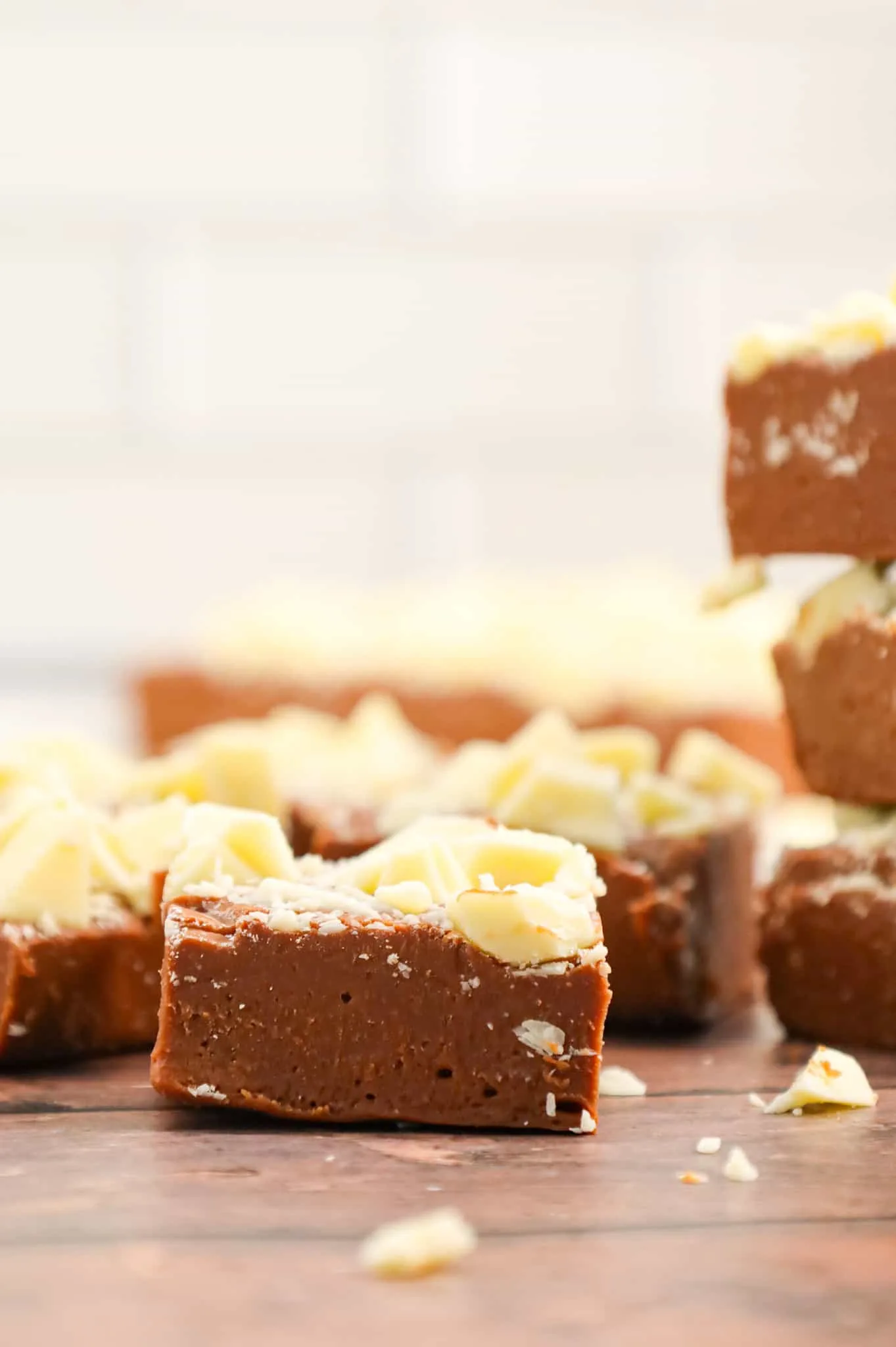 Bailey's Fudge is an easy chocolate fudge recipe made with milk chocolate chips, sweetened condensed milk and Bailey's Irish cream and topped with chopped white chocolate.