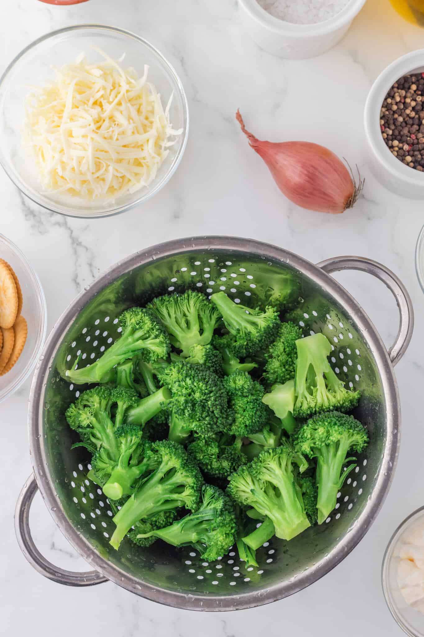 blanched broccoli in a colander