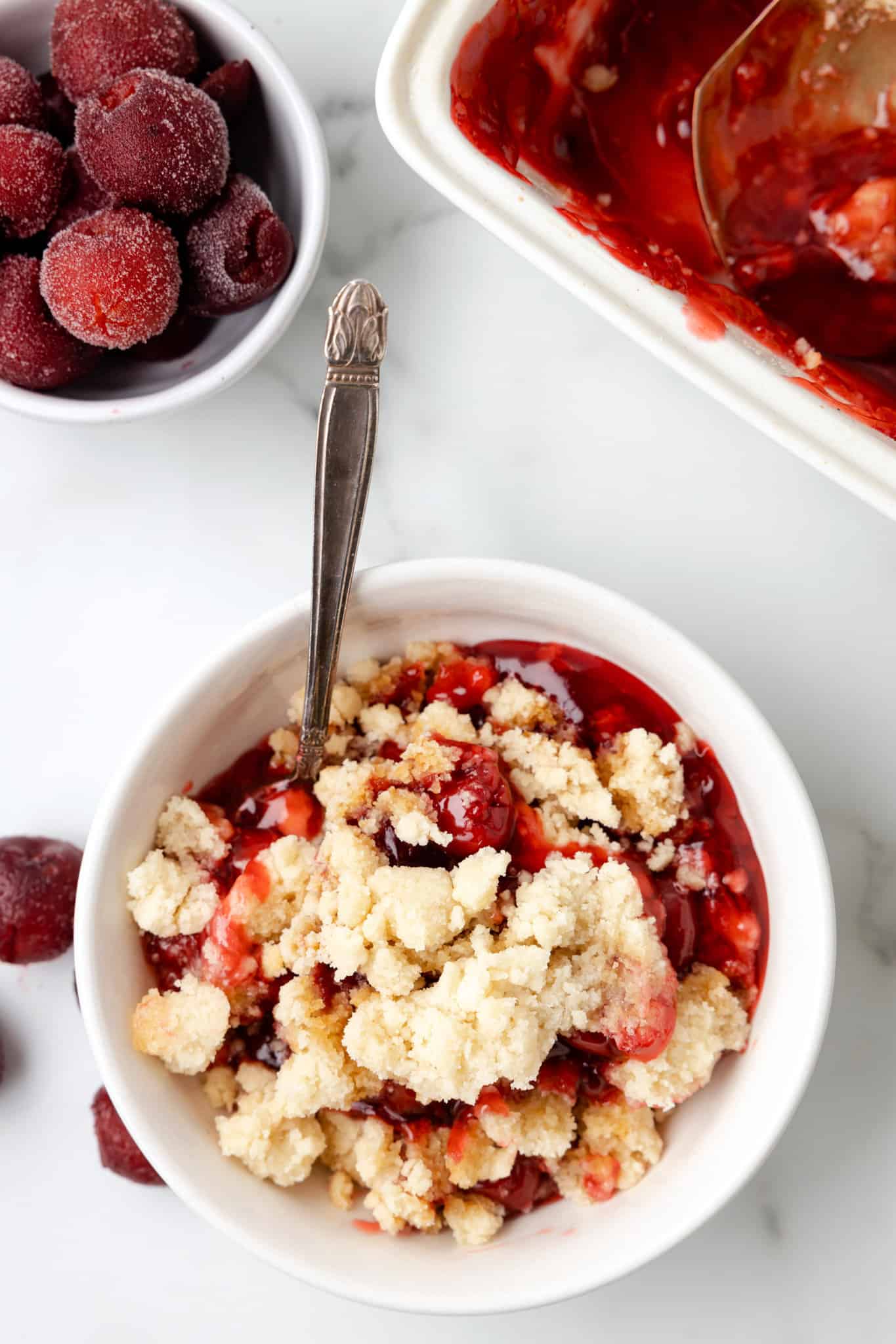 Cherry Cobbler is an easy three ingredient dessert recipe using canned cherry pie filling, sugar cookie mix and butter.