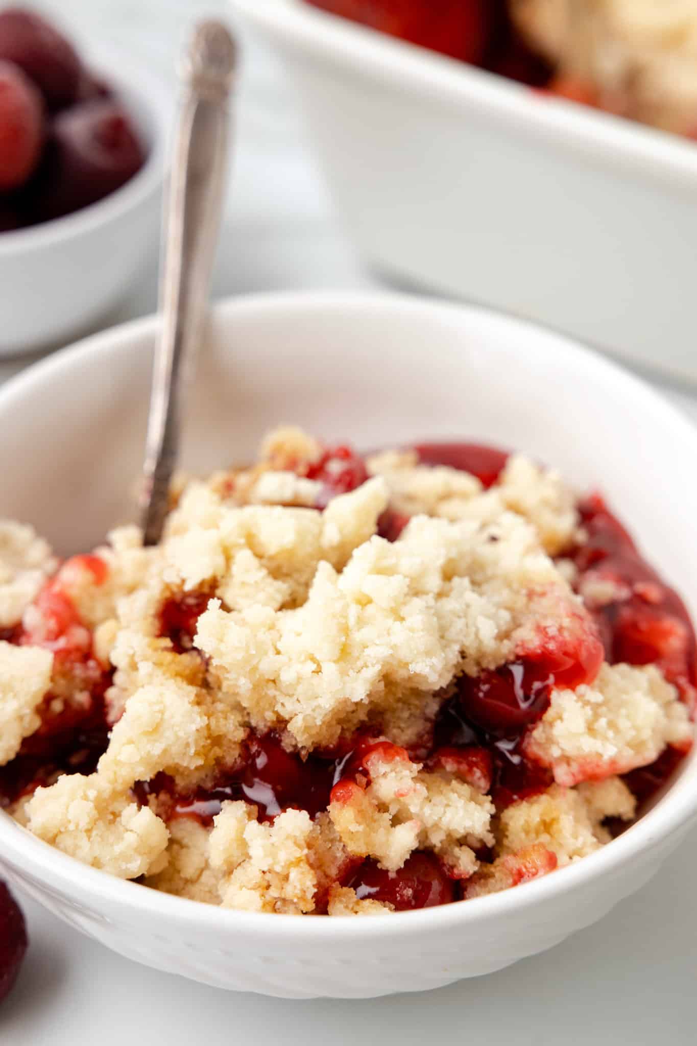 Cherry Cobbler is an easy three ingredient dessert recipe using canned cherry pie filling, sugar cookie mix and butter.