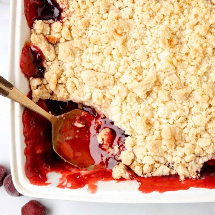 Cherry Cobbler is an easy three ingredient dessert recipe using canned cherry pie filling, sugar cookie mix and butter.