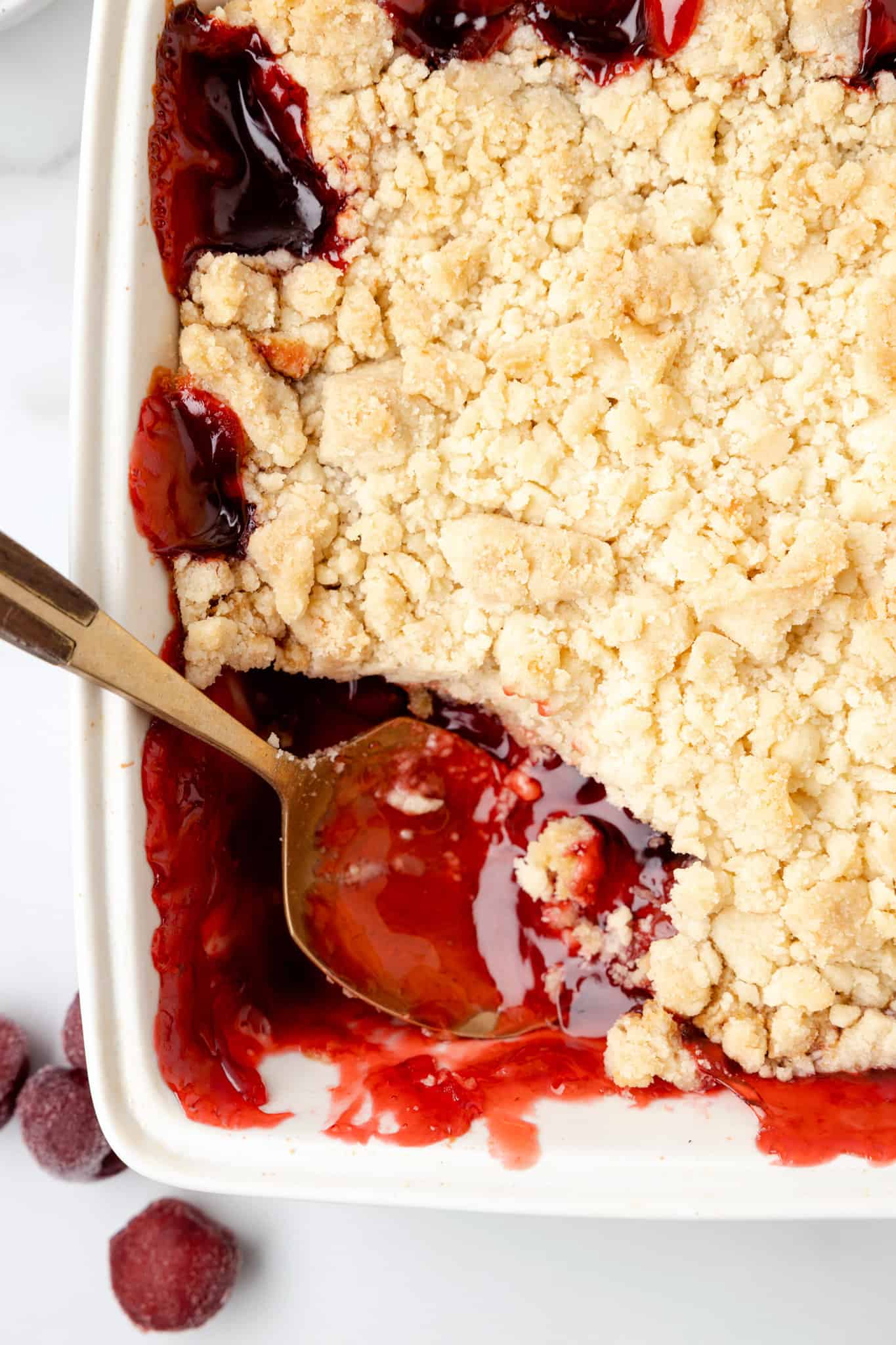 Cherry Cobbler is an easy three ingredient dessert recipe using canned cherry pie filling, sugar cookie mix and butter.