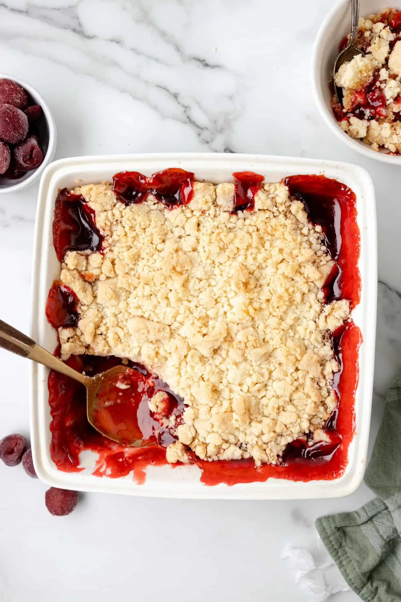 Cherry Cobbler is an easy three ingredient dessert recipe using canned cherry pie filling, sugar cookie mix and butter.