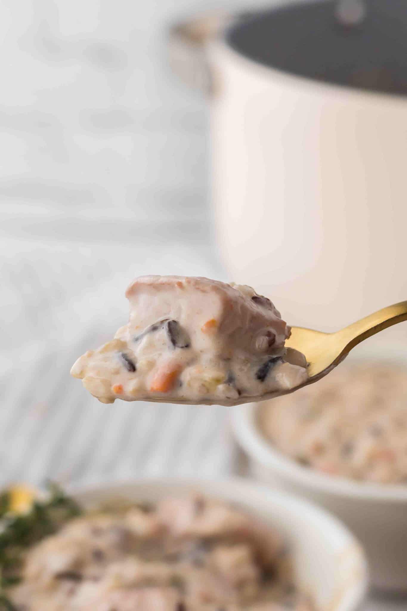 Chicken and Wild Rice Soup is a hearty and creamy soup recipe loaded with chunks of chicken, wild rice, carrots, celery, onions and fresh thyme.