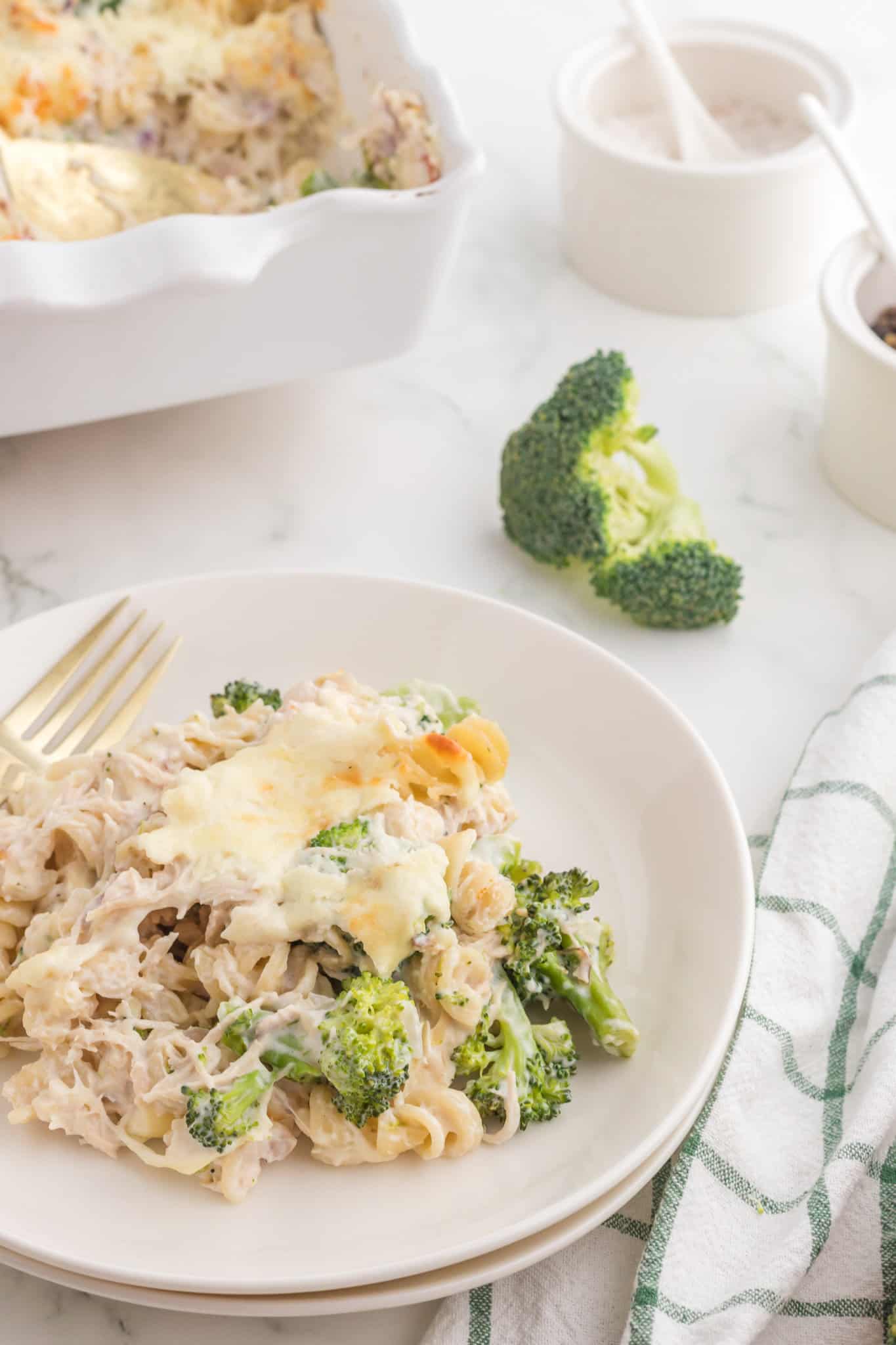 Chicken Broccoli Casserole is a hearty casserole recipe loaded with rotini pasta, shredded chicken and broccoli florets all baked in a creamy sauce and topped with cheddar cheese.