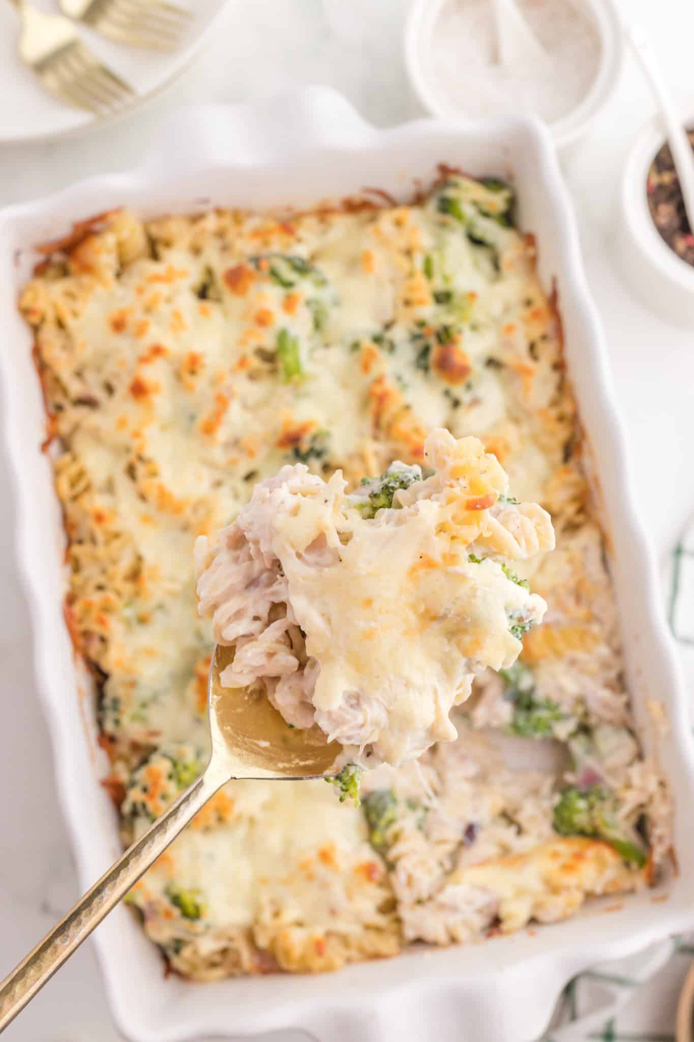 Chicken Broccoli Casserole is a hearty casserole recipe loaded with rotini pasta, shredded chicken and broccoli florets all baked in a creamy sauce and topped with cheddar cheese.