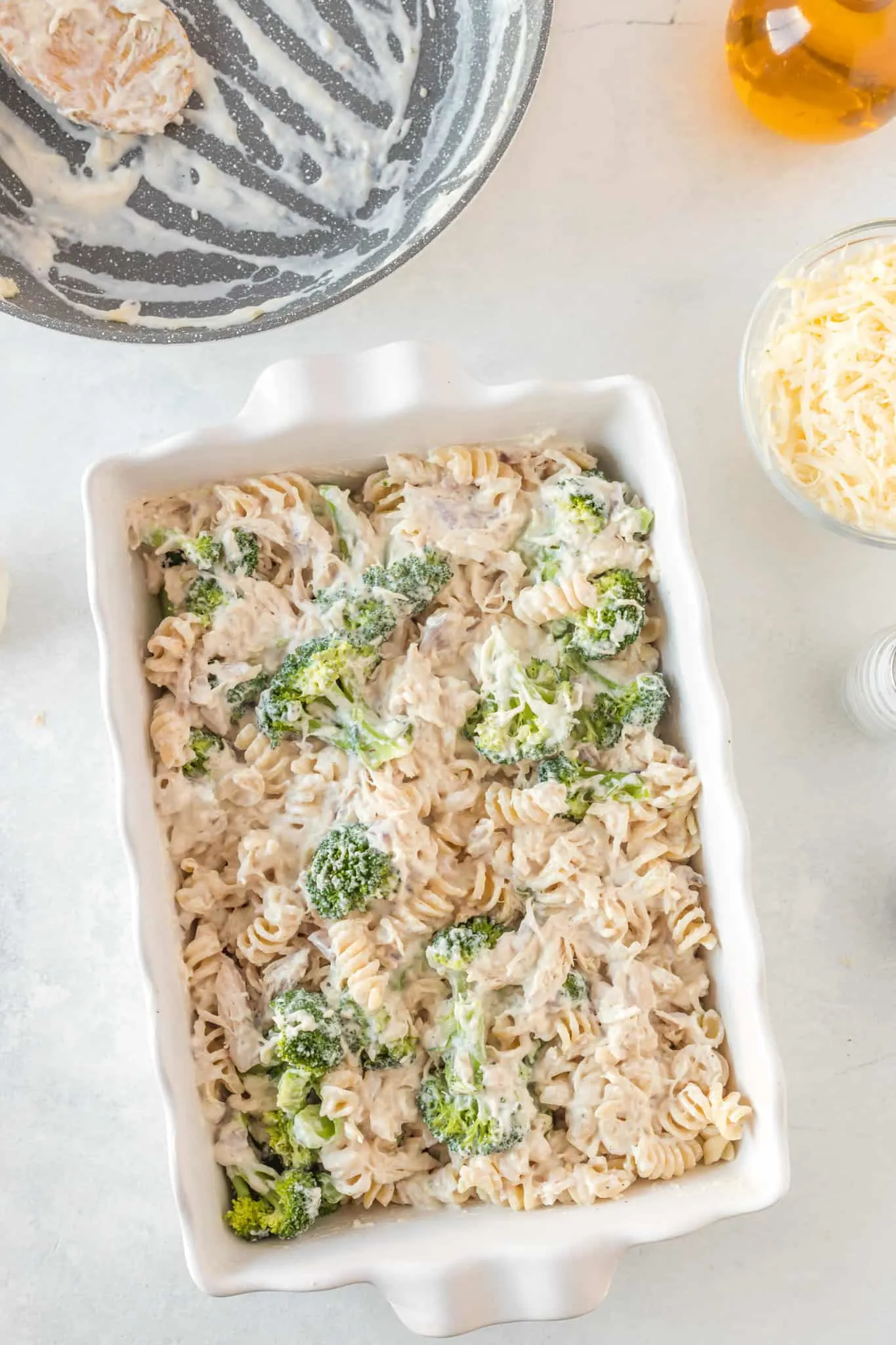 creamy chicken, broccoli and rotini mixture in a baking dish