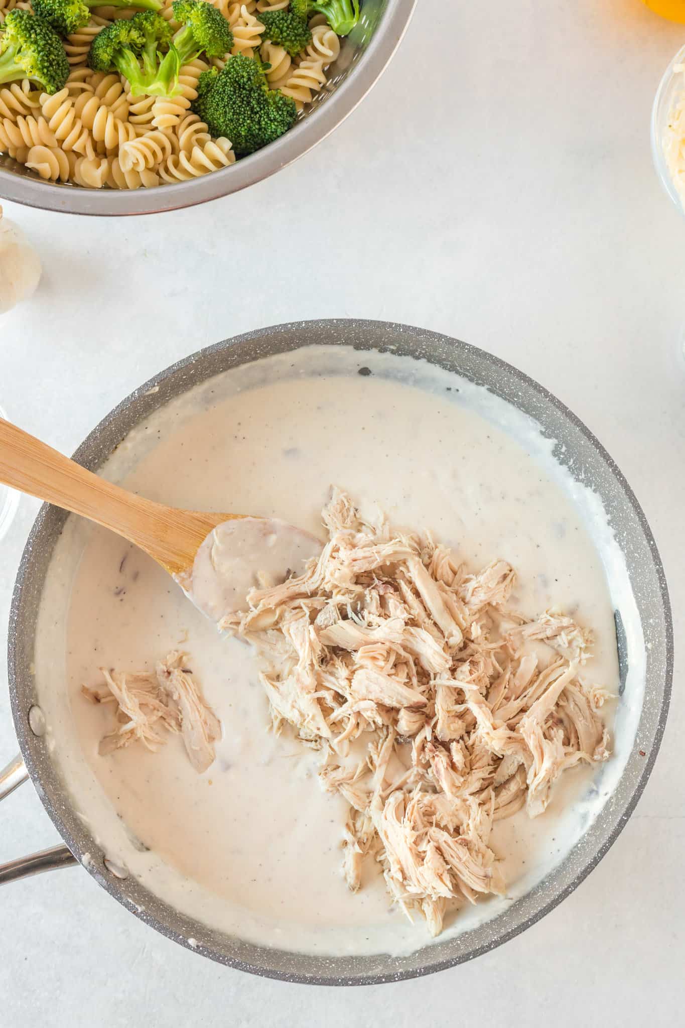shredded chicken added to pan with cream cheese sauce