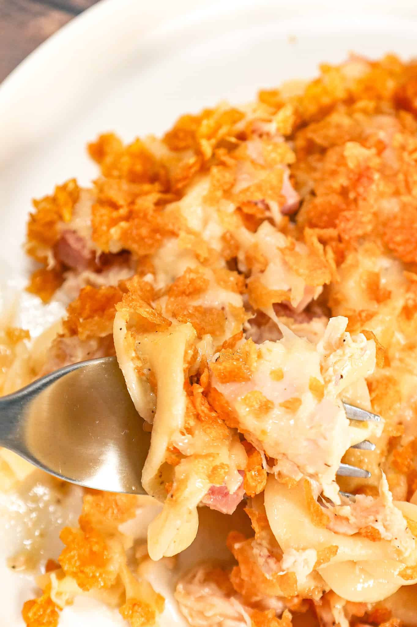 Chicken Cordon Bleu Casserole is an easy casserole recipe loaded with egg noodles, chopped  ham, shredded chicken, cream of chicken soup and topped with Swiss cheese and crumbled cornflakes.