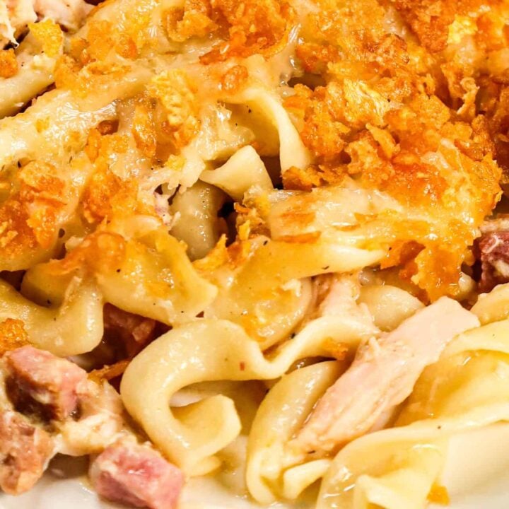 Chicken Cordon Bleu Casserole is an easy casserole recipe loaded with egg noodles, chopped  ham, shredded chicken, cream of chicken soup and topped with Swiss cheese and crumbled cornflakes.