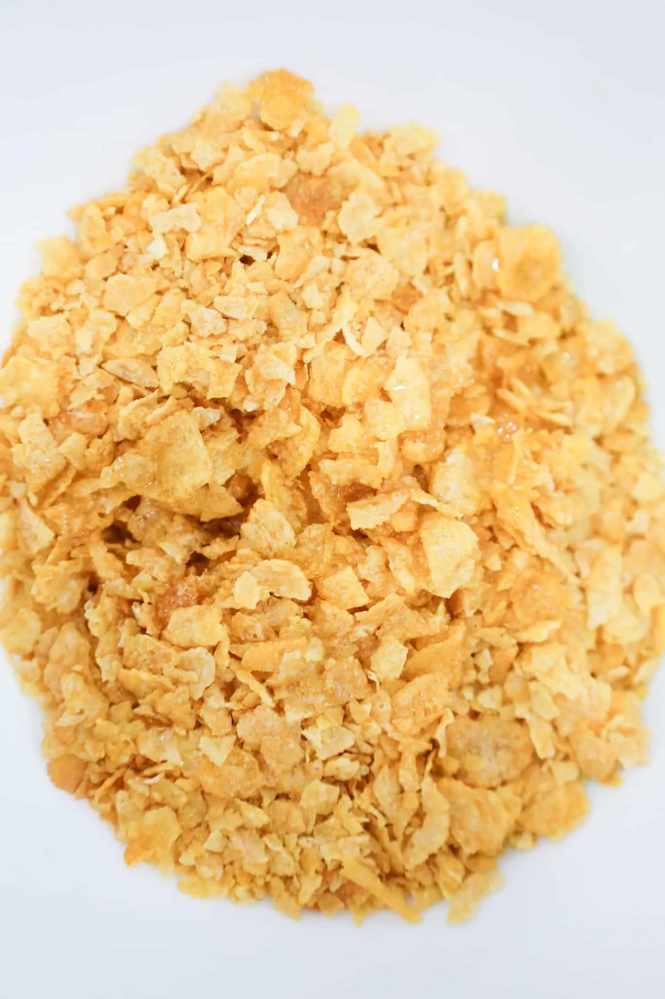 crumbled cornflakes in a mixing bowl