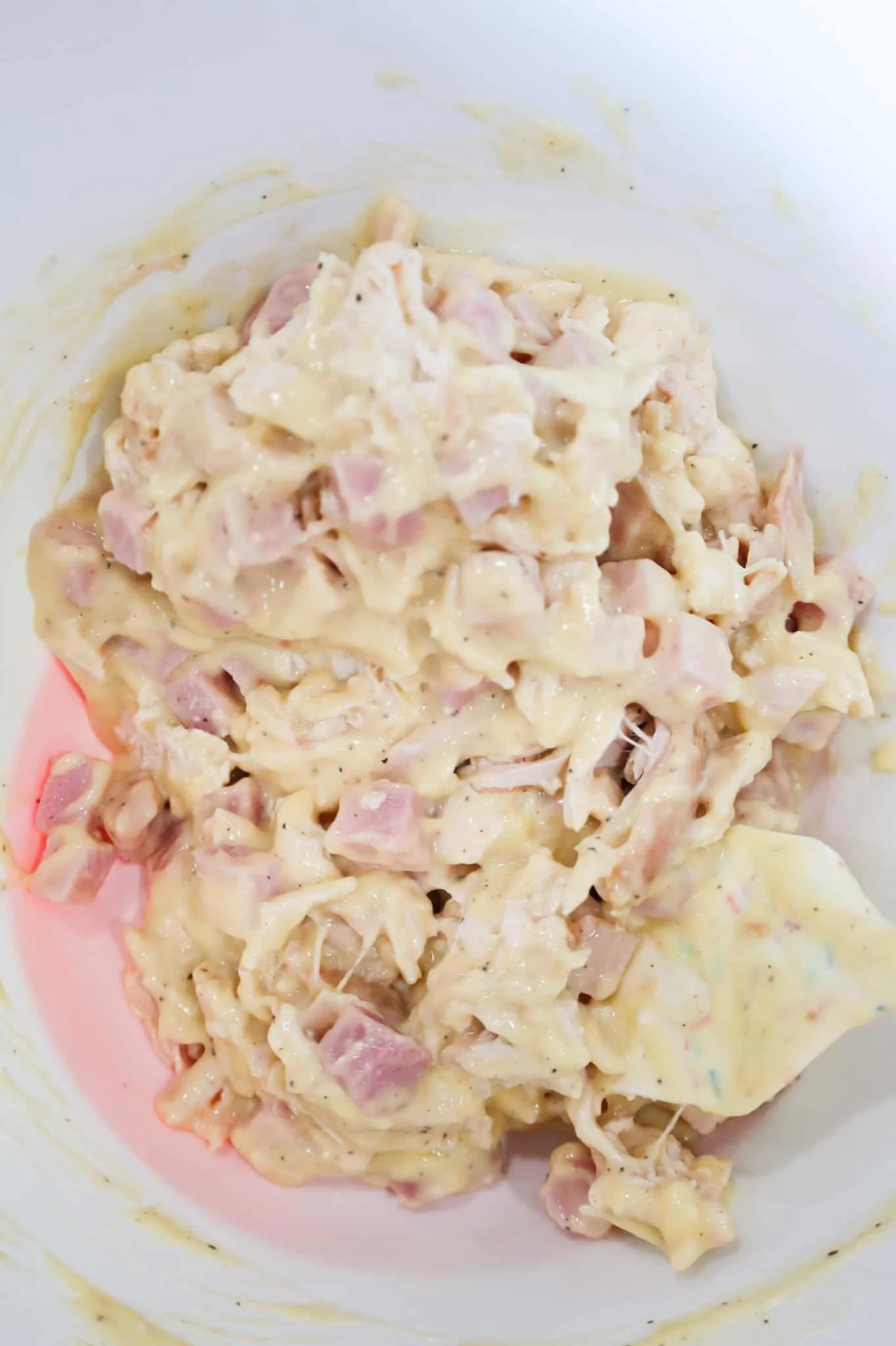 chicken, ham and cream of chicken soup mixture in a mixing bowl
