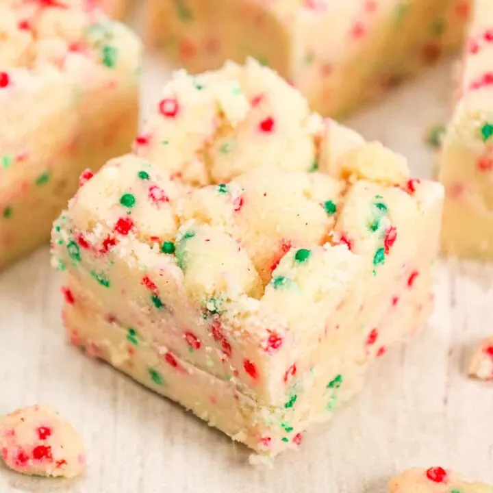 Christmas Sugar Cookie Fudge is a delicious holiday treat loaded with baked sugar cookie crumble, sprinkles, sweetened condensed milk and white chocolate chips.
