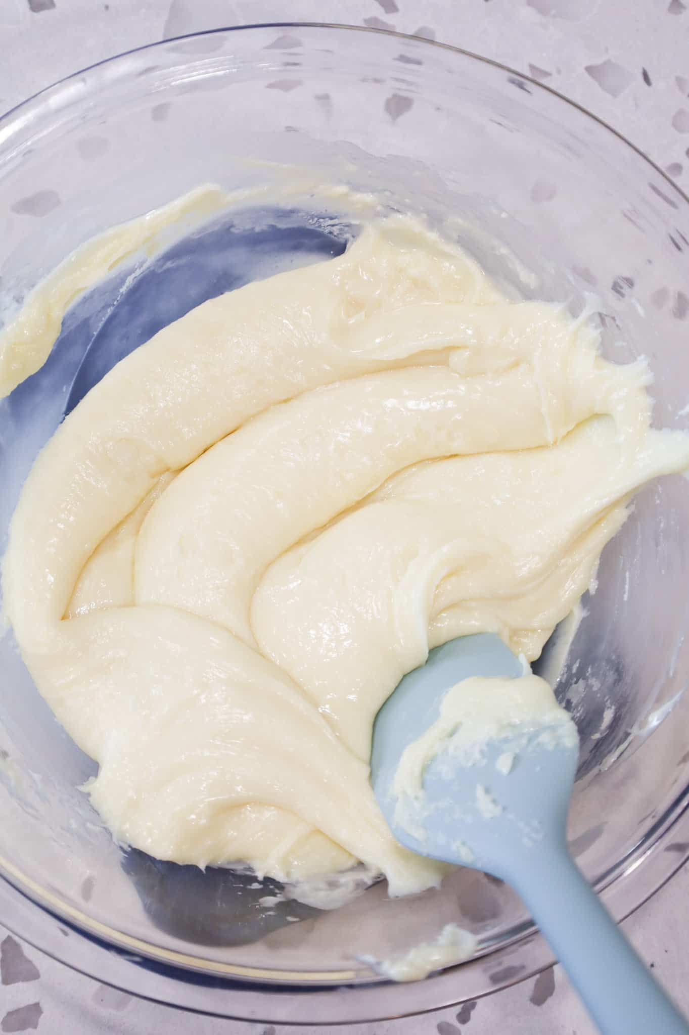 white chocolate and sweetened condensed milk mixture in a mixing bowl
