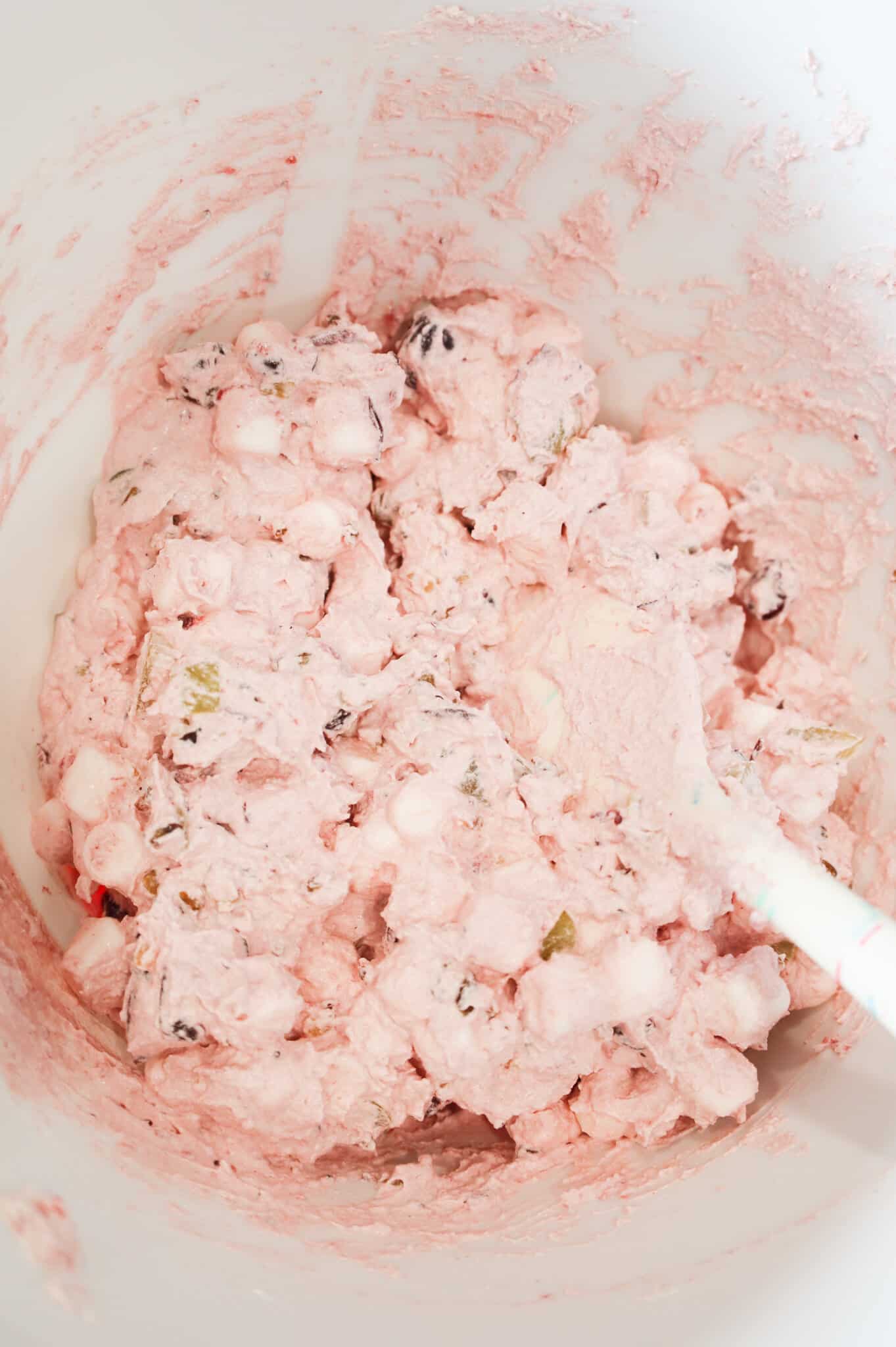 cranberry fluff mixture in a mixing bowl