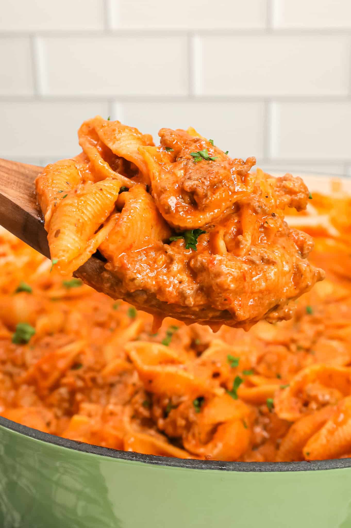 Creamy Beef and Shells is an easy ground beef pasta recipe with a creamy tomato sauce made with marinara, sour cream, heavy cream and shredded cheddar cheese.