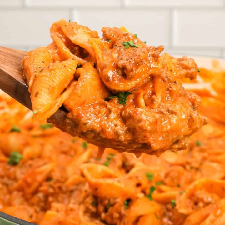 Creamy Beef and Shells is an easy ground beef pasta recipe with a creamy tomato sauce made with marinara, sour cream, heavy cream and shredded cheddar cheese.