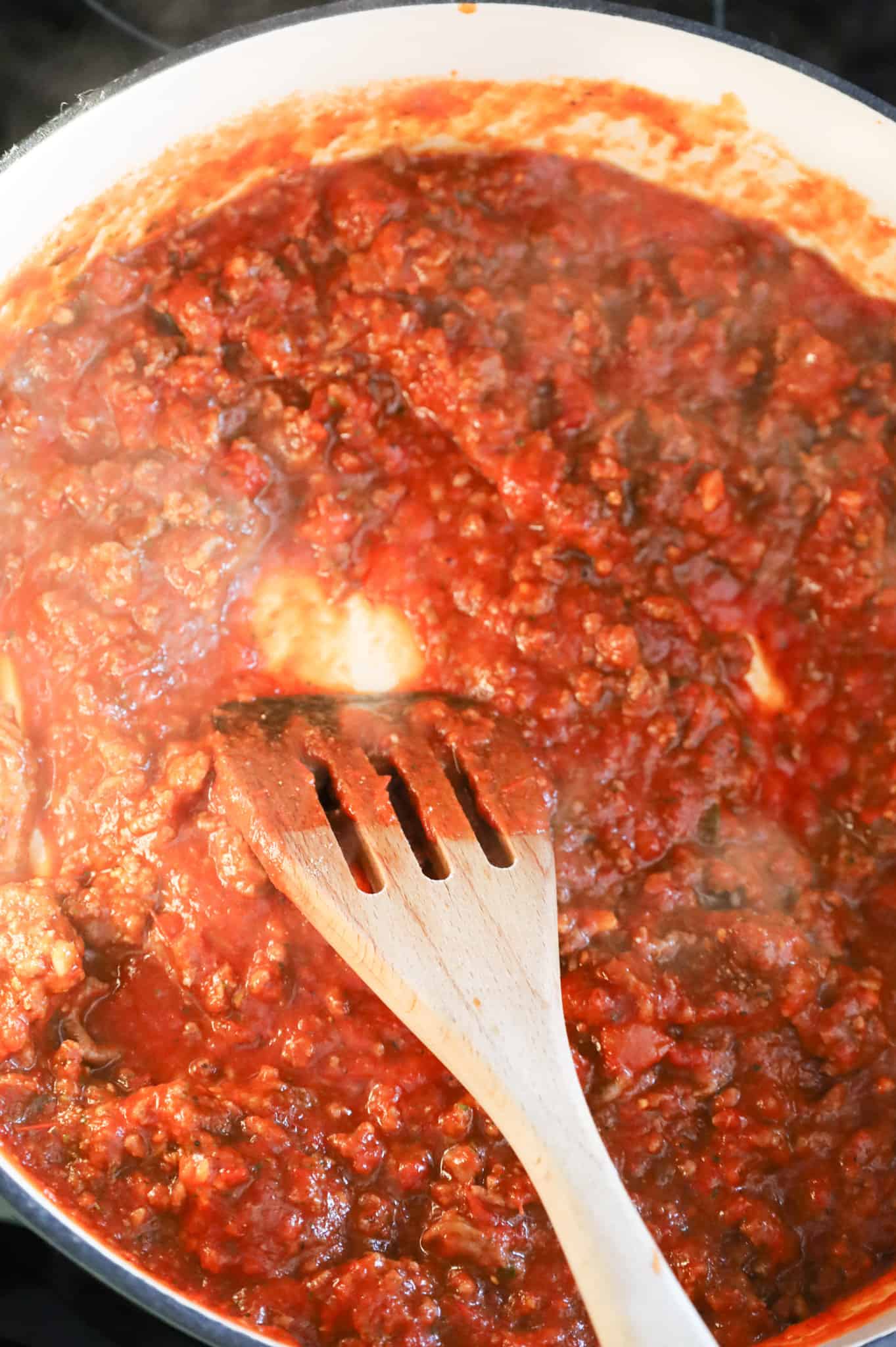 ground beef and marinara sauce mixture in a skillet