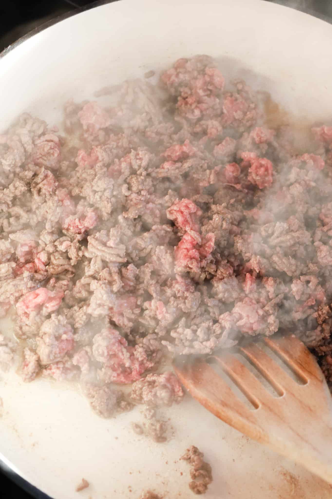 ground beef cooking in a skillet