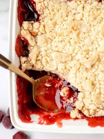 Cherry Cobbler is an easy three ingredient dessert recipe using canned cherry pie filling, sugar cookie mix and butter.