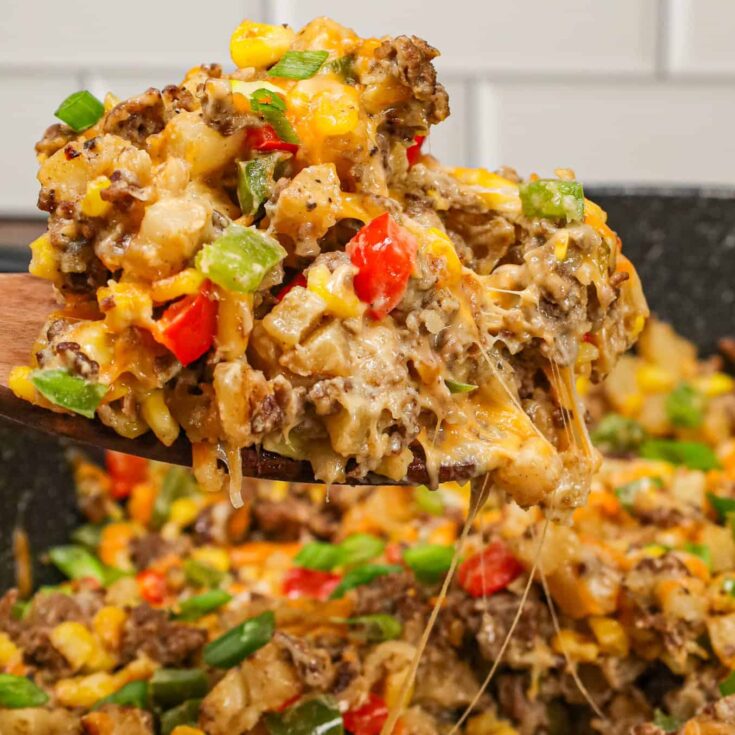 Ground Beef and Potatoes is an easy weeknight dinner recipe loaded with diced hash brown potatoes, ground beef, corn, diced bell peppers, cream of mushroom soup and shredded cheddar cheese.