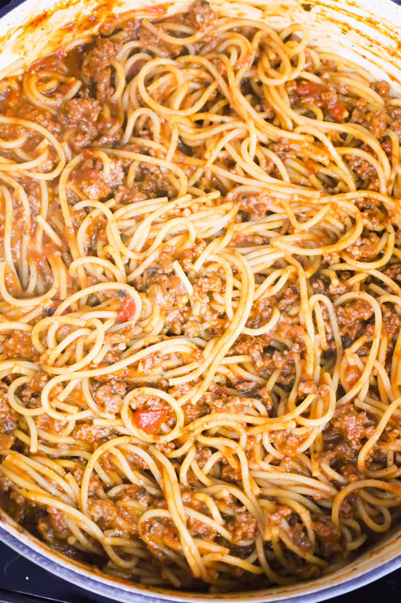 parmesan cheese stirred into ground beef spaghetti mixture