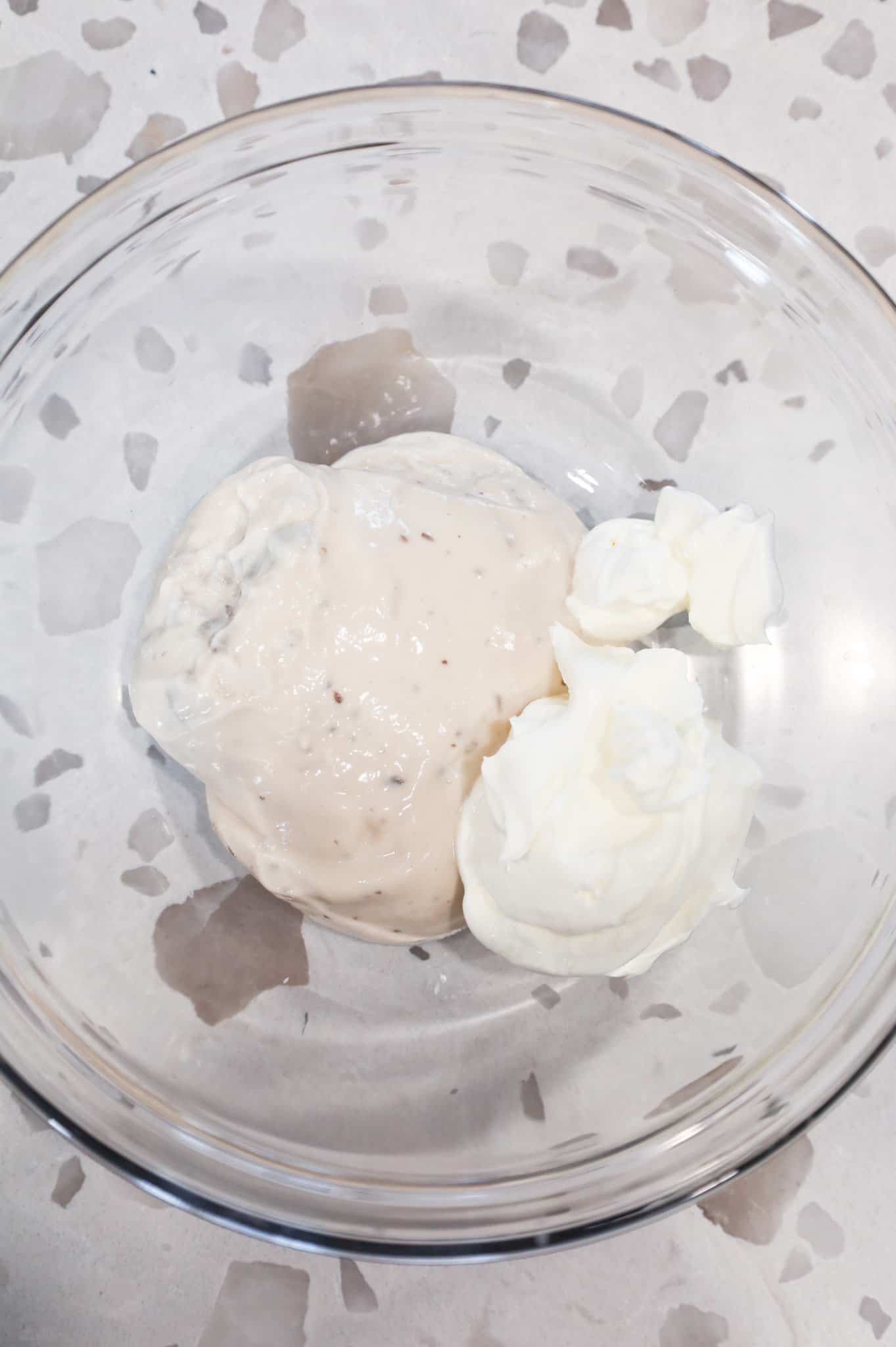 cream of mushroom soup and sour cream in a mixing bowl