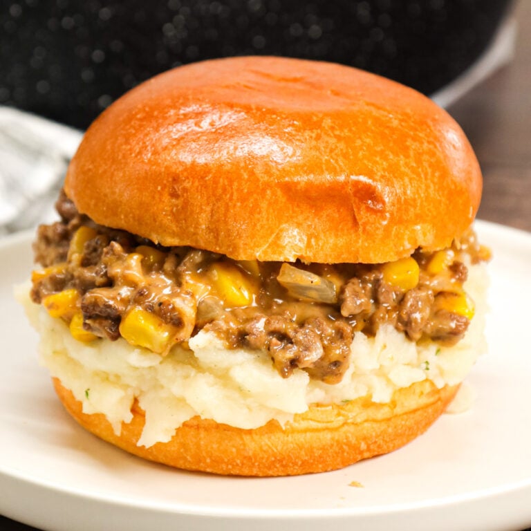 Shepherd's Pie Sloppy Joes are a hearty ground beef dinner recipe made with instant mashed potatoes, corn, diced onions, brown gravy mix and shredded cheese all served on toasted Brioche buns.
