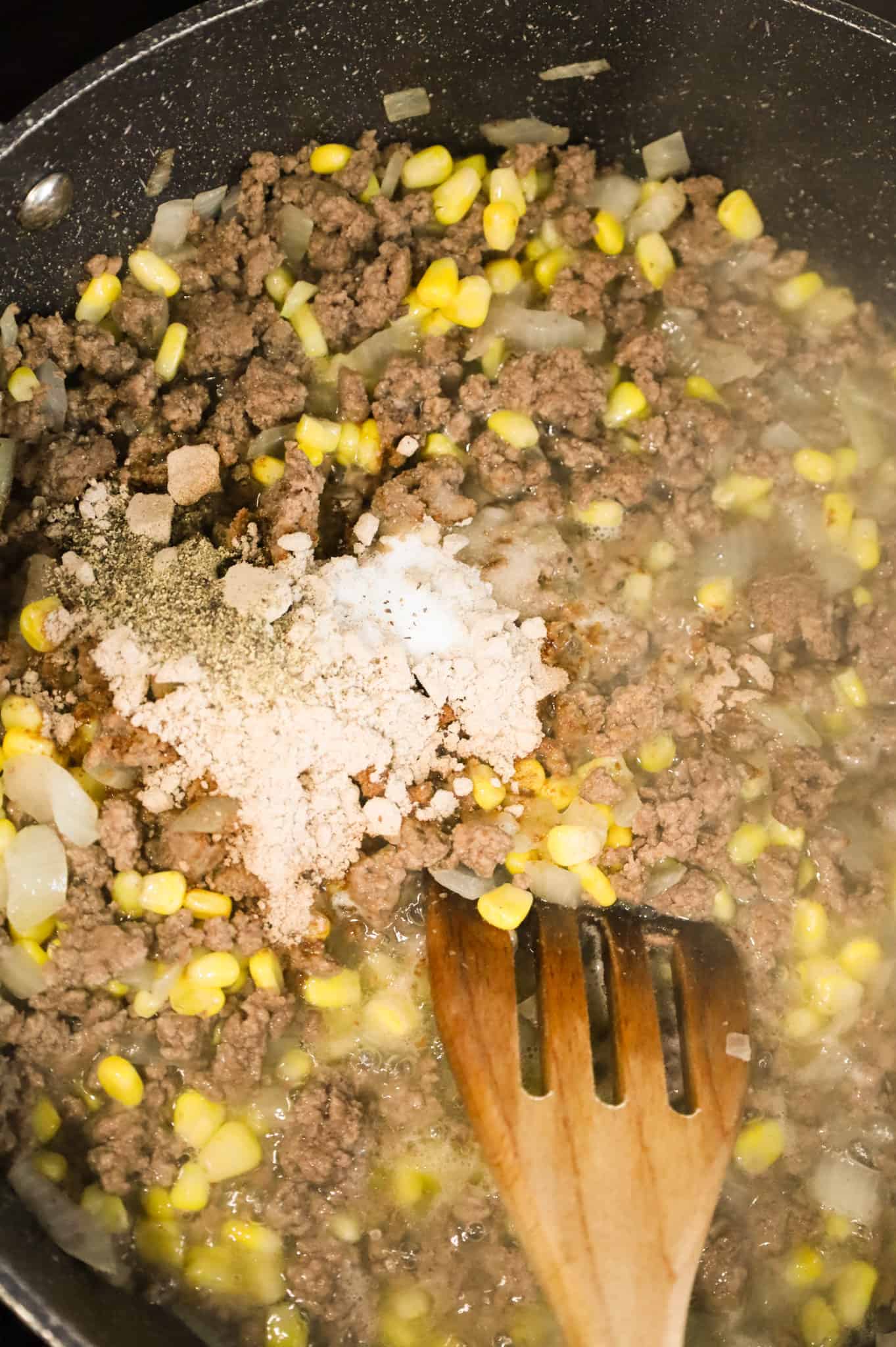 salt, pepper brown gravy mix and water added to skillet with ground beef mixture