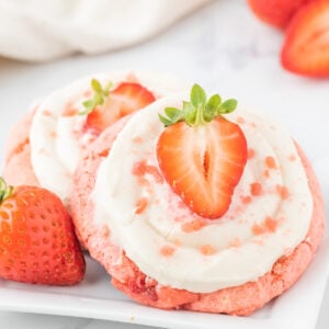 Strawberry Cheesecake Cookies are simple and delicious cookies made with boxed strawberry cake mix and fresh chopped strawberries, topped with a homemade cream cheese frosting.