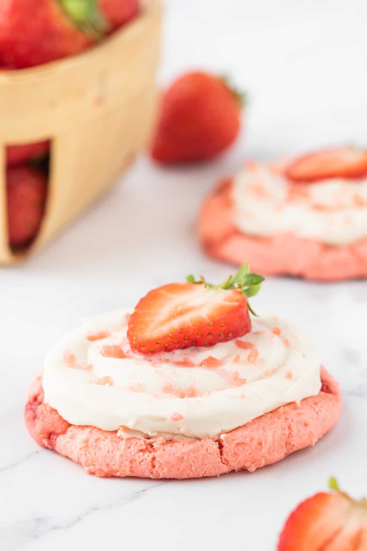 Strawberry Cheesecake Cookies are simple and delicious cookies made with boxed strawberry cake mix and fresh chopped strawberries, topped with a homemade cream cheese frosting.