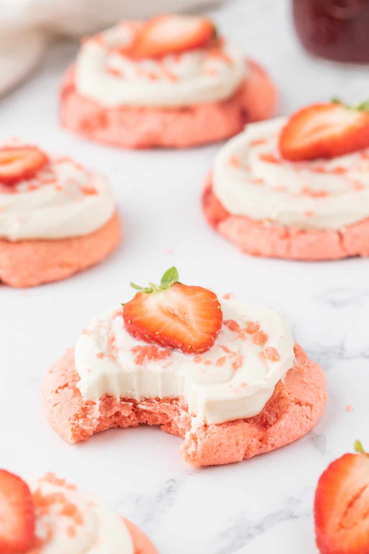 Strawberry Cheesecake Cookies are simple and delicious cookies made with boxed strawberry cake mix and fresh chopped strawberries, topped with a homemade cream cheese frosting.