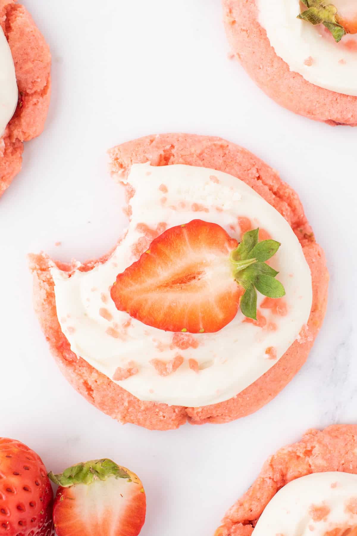 Strawberry Cheesecake Cookies are simple and delicious cookies made with boxed strawberry cake mix and fresh chopped strawberries, topped with a homemade cream cheese frosting.