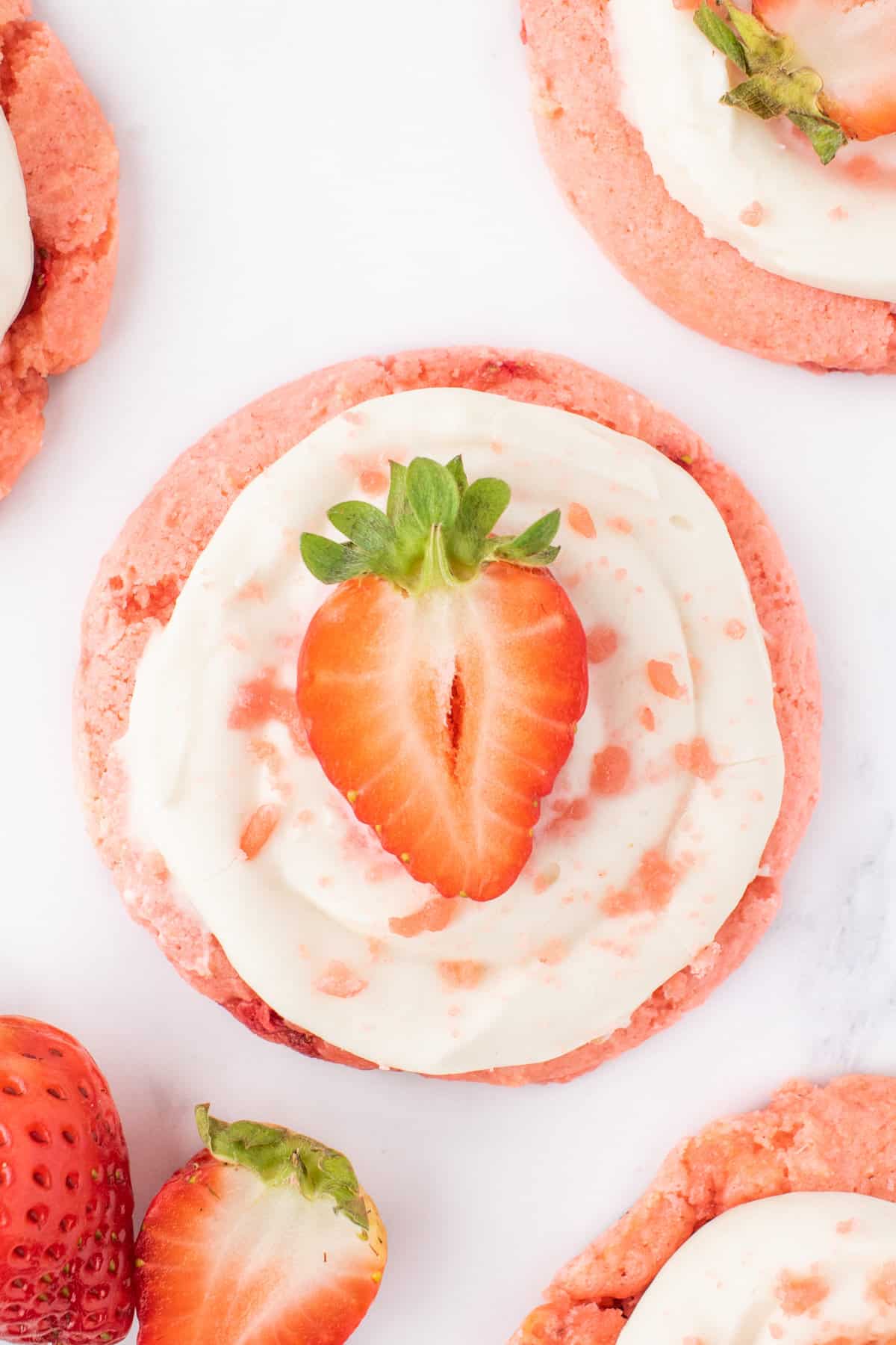 Strawberry Cheesecake Cookies are simple and delicious cookies made with boxed strawberry cake mix and fresh chopped strawberries, topped with a homemade cream cheese frosting.