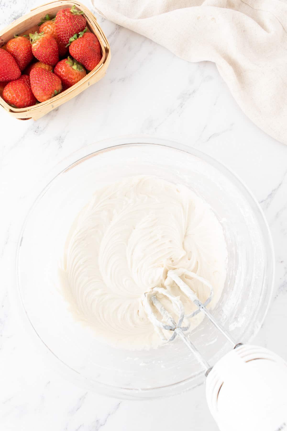 cream cheese frosting mixture in a mixing bowl