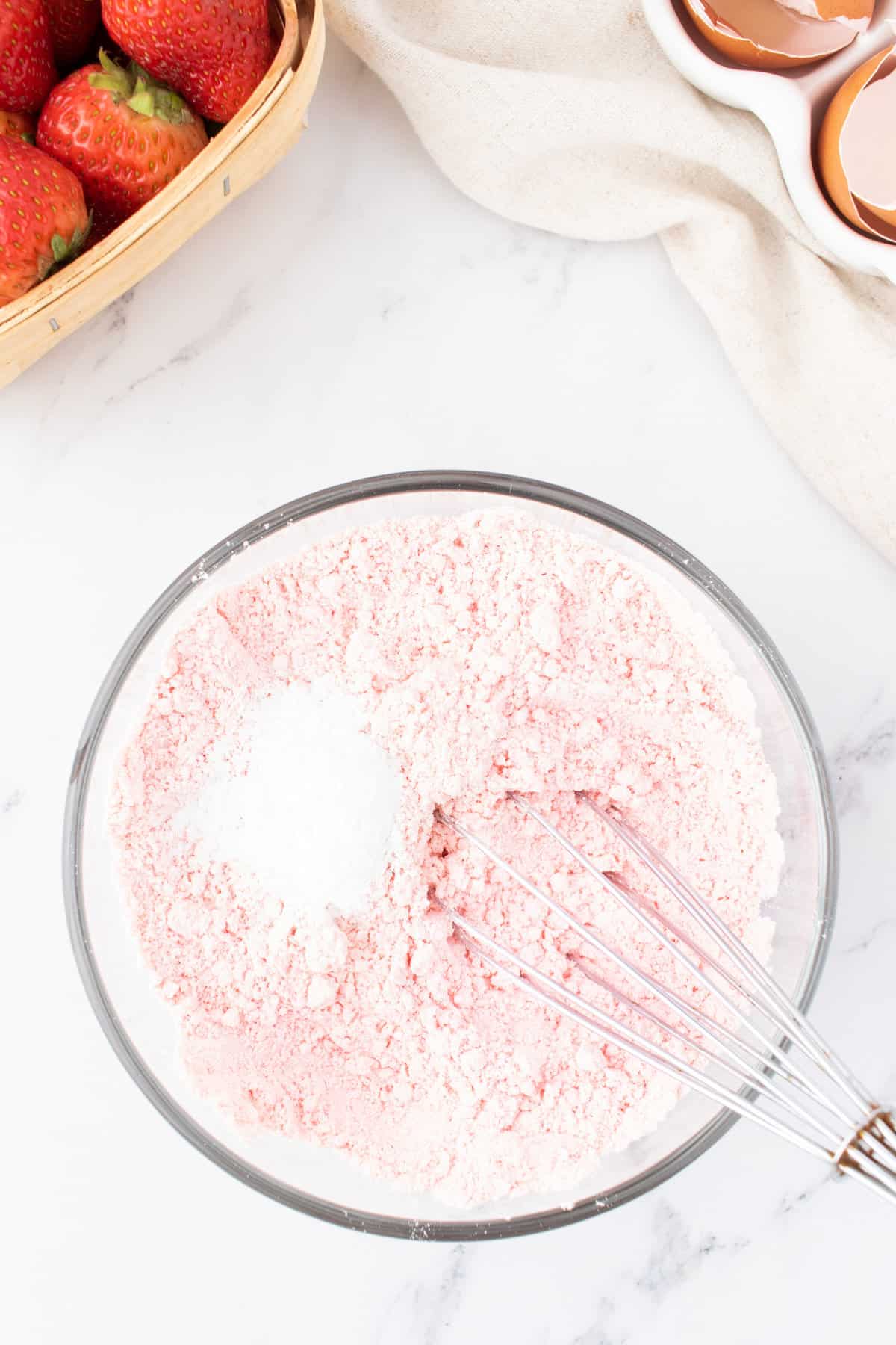 strawberry cake mix and baking powder in a mixing bowl