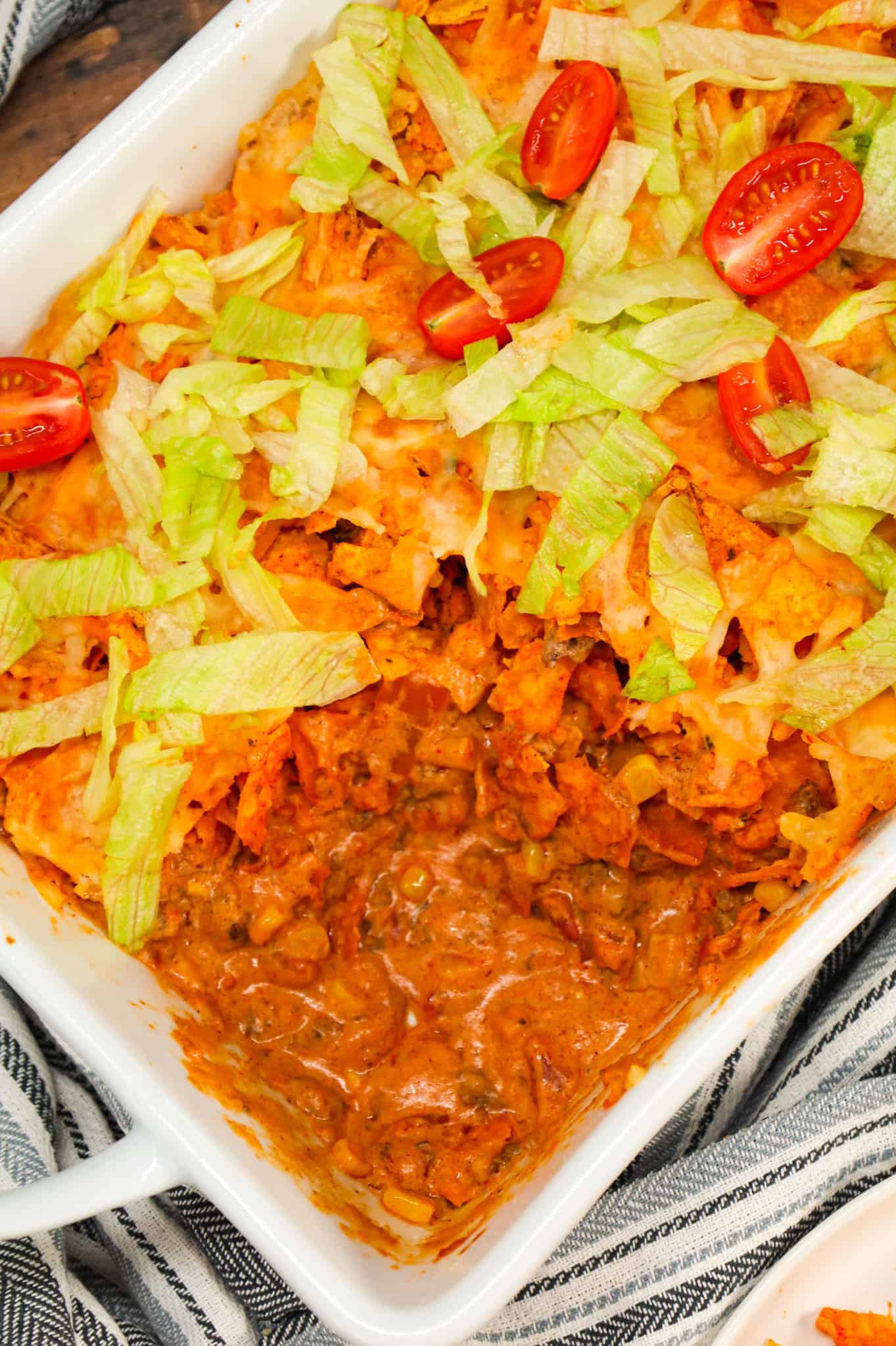 Taco Casserole with Doritos is an easy ground beef casserole recipe loaded with Rotel diced tomatoes and green chilies, salsa, cheddar cheese soup, corn, crumbled Doritos nacho chips and shredded cheese.