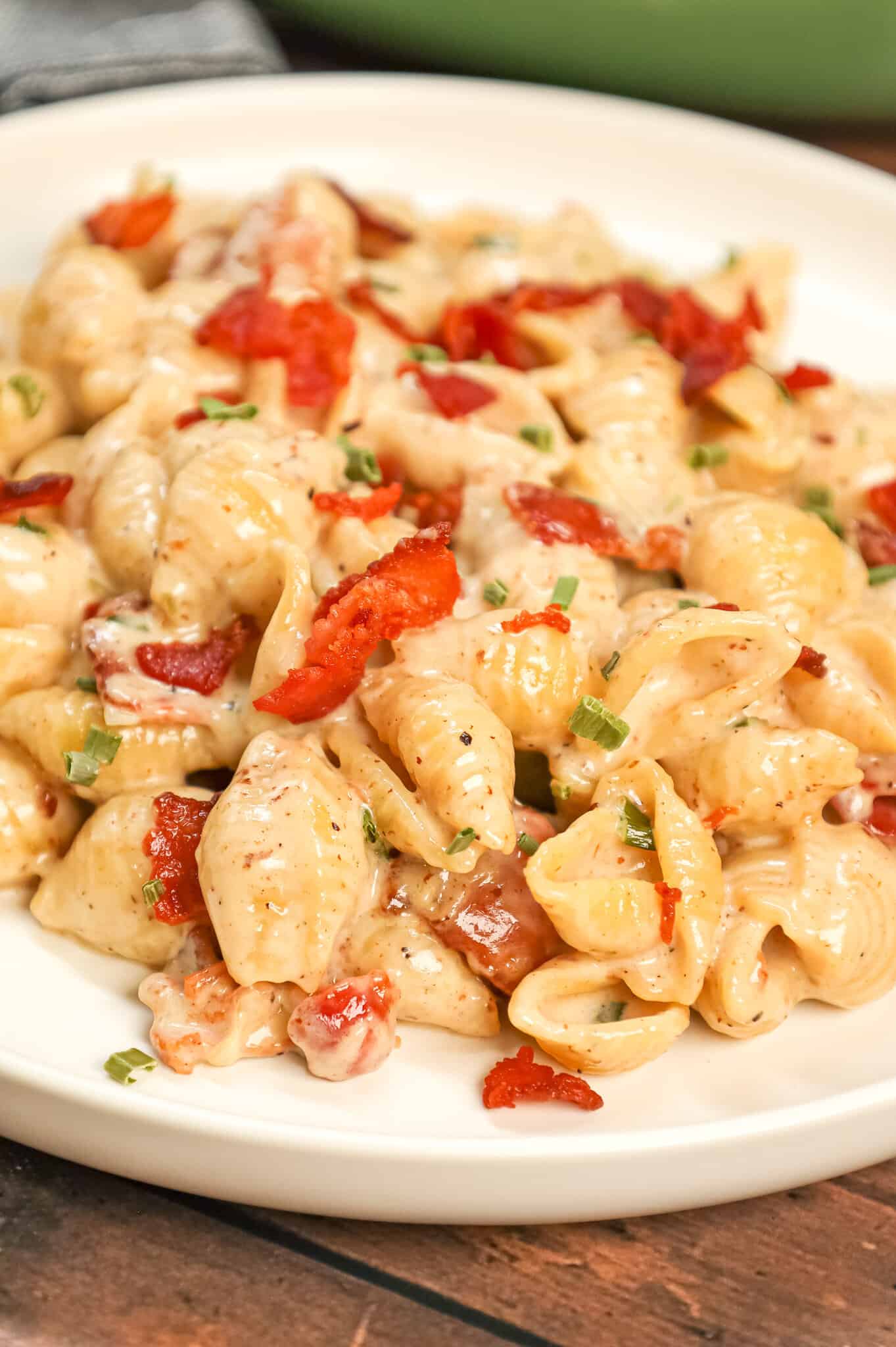 Bacon Pasta is a creamy shell pasta recipe loaded with crispy crumbled bacon pieces and flavoured with garlic and parmesan cheese.