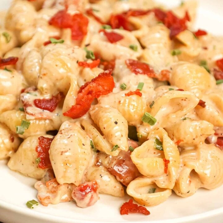 Bacon Pasta is a creamy shell pasta recipe loaded with crispy crumbled bacon pieces and flavoured with garlic and parmesan cheese.