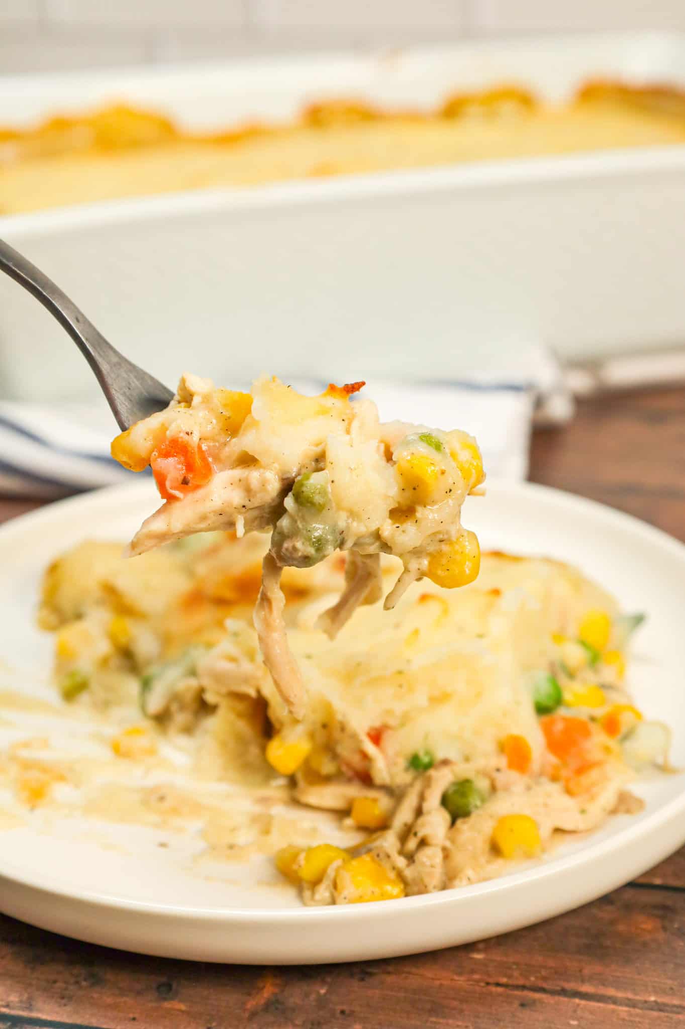 Chicken Shepherd's Pie is an easy dinner recipe loaded with shredded rotisserie chicken, mixed veggies, cream of mushroom soup and cream of chicken soup all baked with a layer of instant mashed potatoes on top.