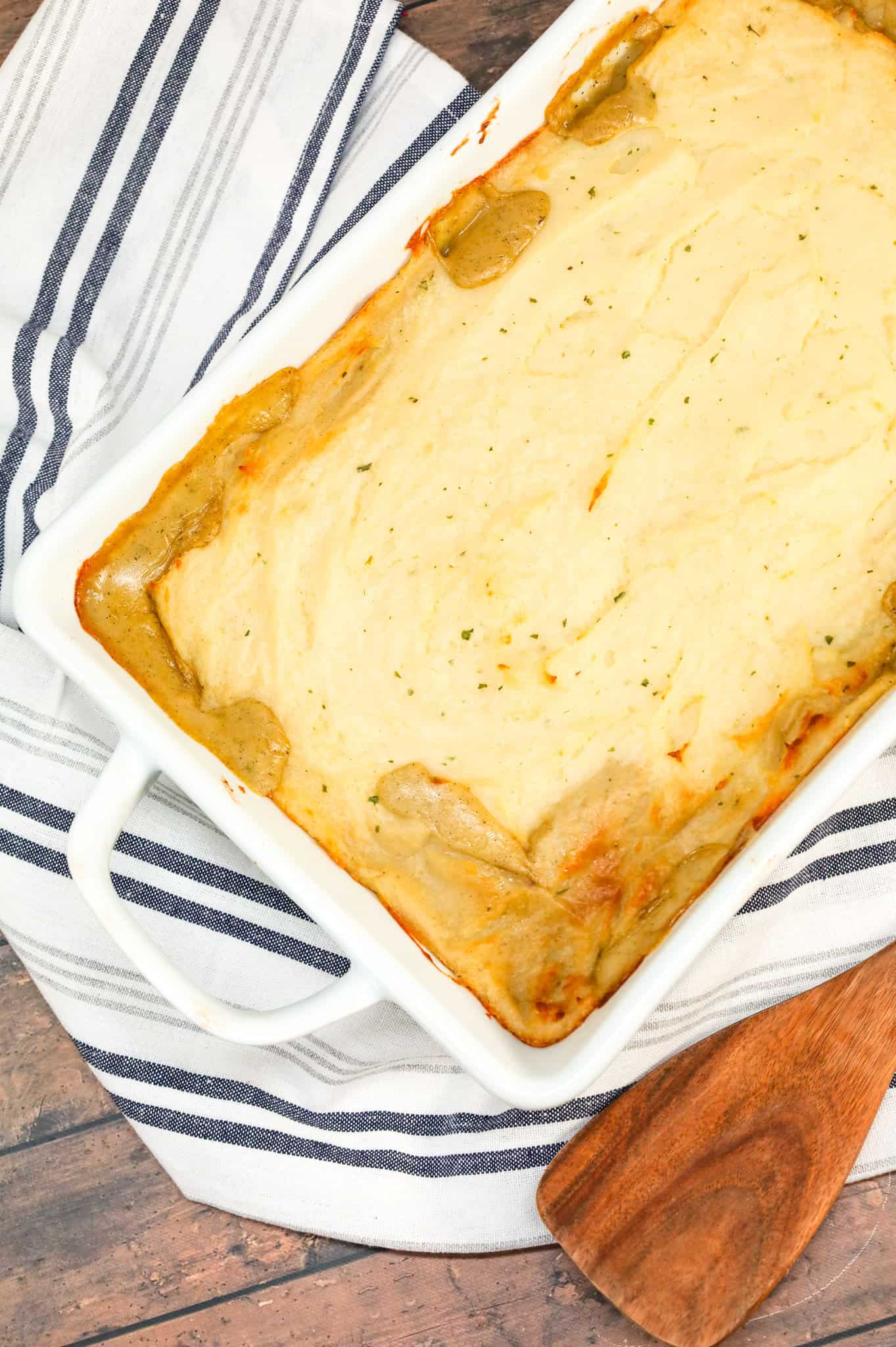 Chicken Shepherd's Pie is an easy dinner recipe loaded with shredded rotisserie chicken, mixed veggies, cream of mushroom soup and cream of chicken soup all baked with a layer of instant mashed potatoes on top.