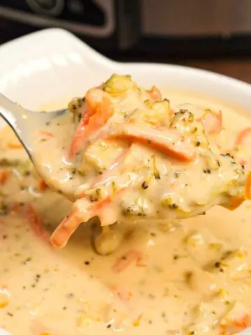 Crock Pot Broccoli Cheddar Soup is a hearty cream soup recipe loaded with broccoli florets, carrots and cheddar cheese.